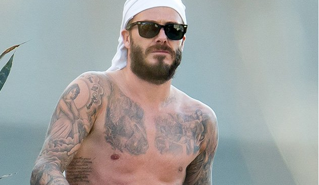 Shirtless David Beckham displays rock hard abs in Miami